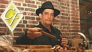 Cigar roller at corproate golf event